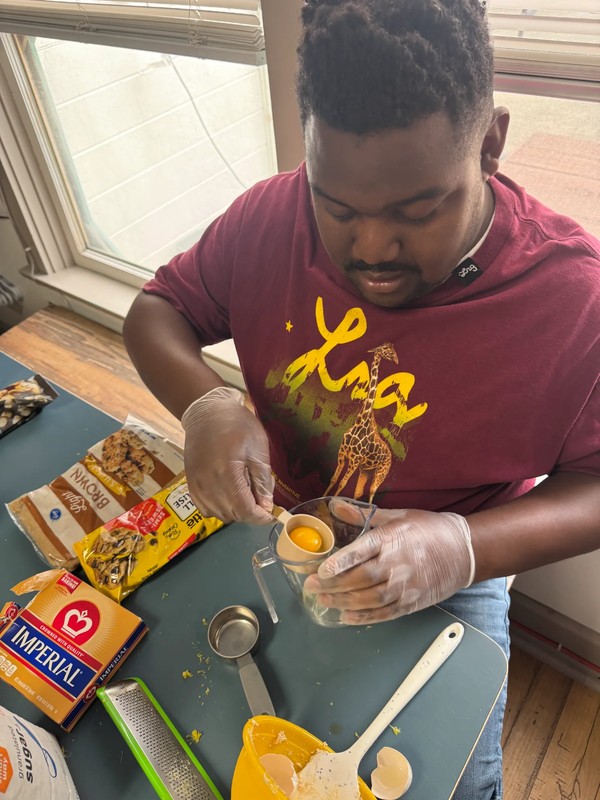 Adult ADP participant following recipie to make cookies