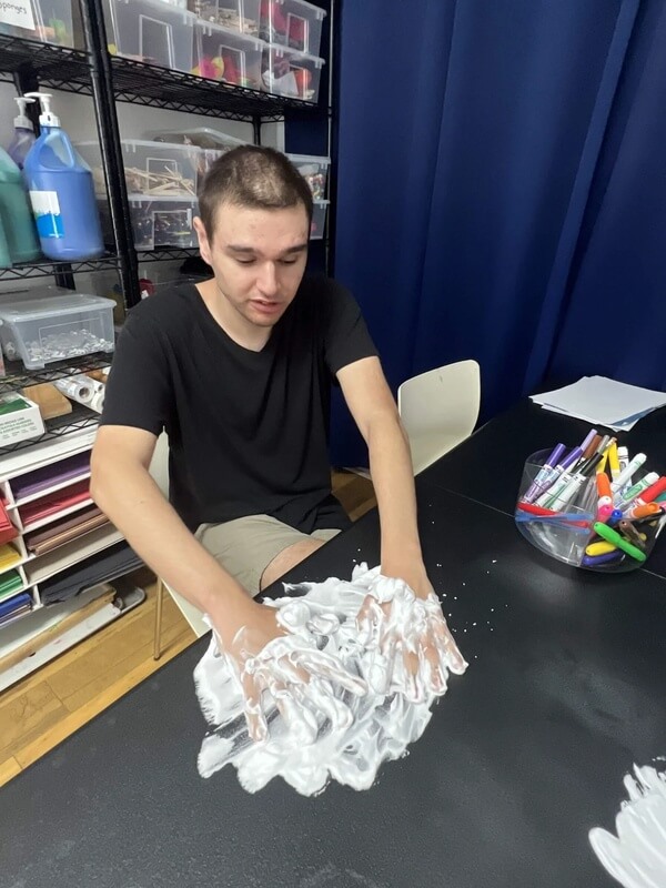 Adult day program participants in creative arts activity