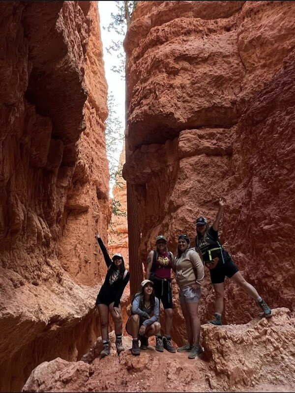 Ivey Ranch Adult Day Program staff members enjoying a team-building canyon hiking adventure. Our dedicated teachers create meaningful connections through outdoor activities in Oceanside, CA.