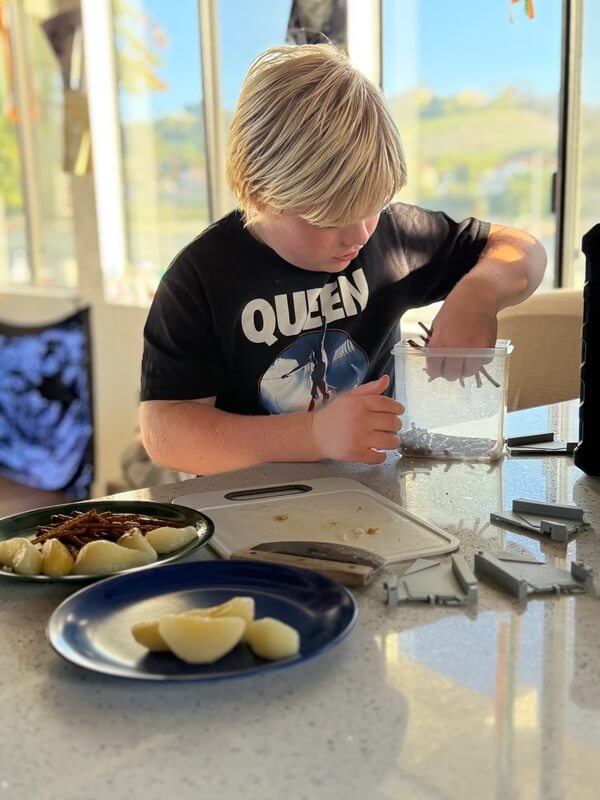 Young child preparing snacks at after-school program