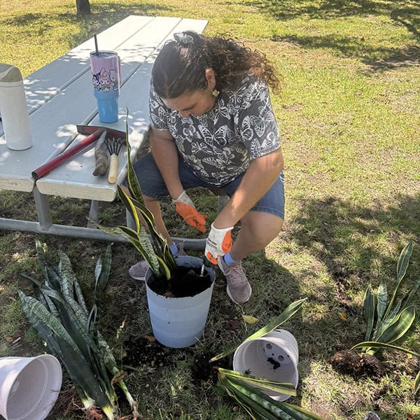 Participant in the Tailored Day Service at Ivey Ranch planting