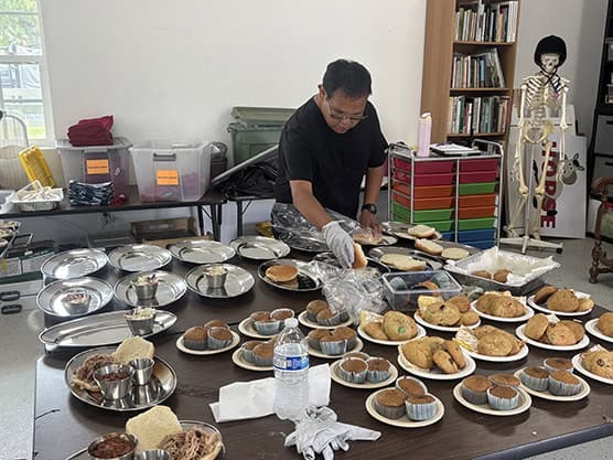 Participant in the Tailored Day Service at Ivey Ranch preparing food for an event