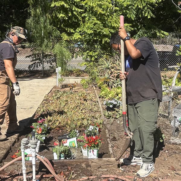 TDS participant working in the garden