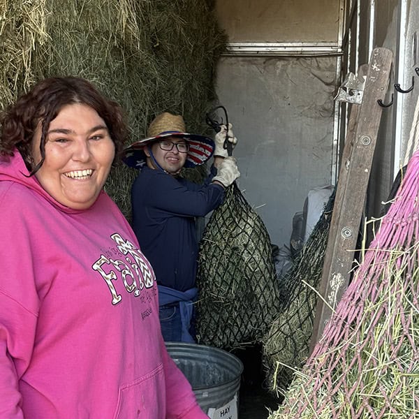 Two Ivey Ranch TDS participant working in the equestrian center