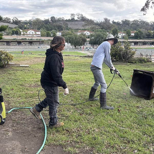 Two Ivey Ranch TDS participant working on facility cleaning