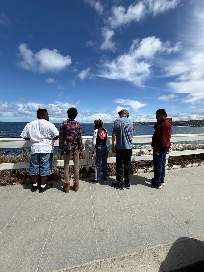 Ivey Ranch Adult Day Program participants taking in the ocean view during a community outing in San Diego County