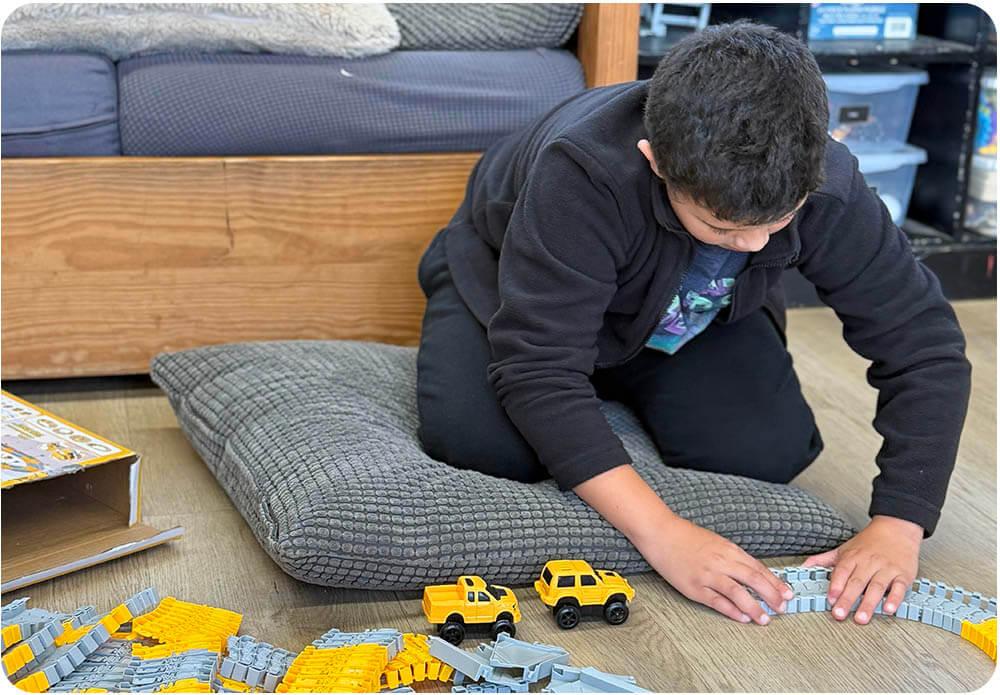 Child playing at home during in-home respite care at Ivey Ranch in Oceanside, CA