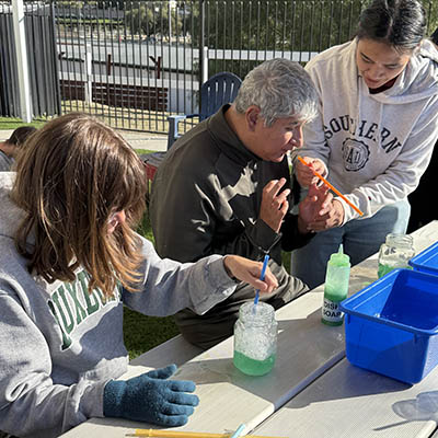 Out-of-home respite participants doing an outdoor science activity at Ivey Ranch in Oceanside, CA