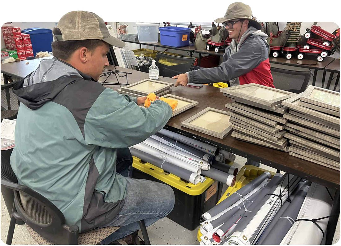 Tailored Day Service participants cleaning frames during event prep at Ivey Ranch in Oceanside, CA