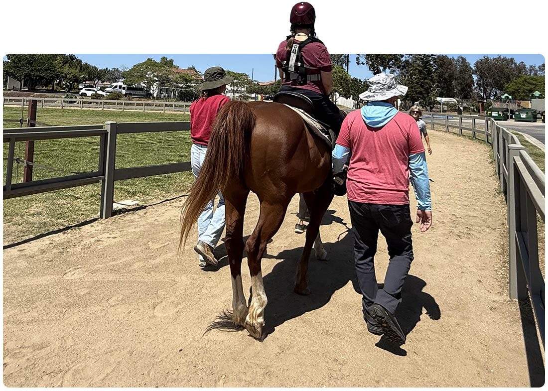 A therapeutic riding lesson with volunteer side-walkers at Ivey Ranch in Oceanside, CA