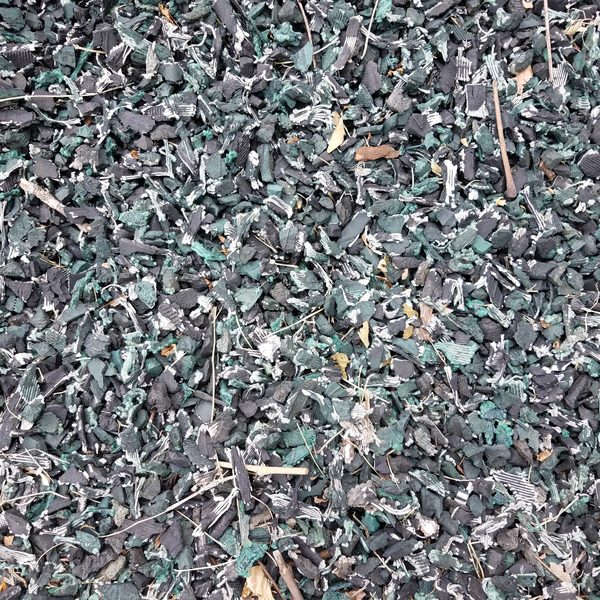 Close-up of recycled rubber mulch needed for the park playground